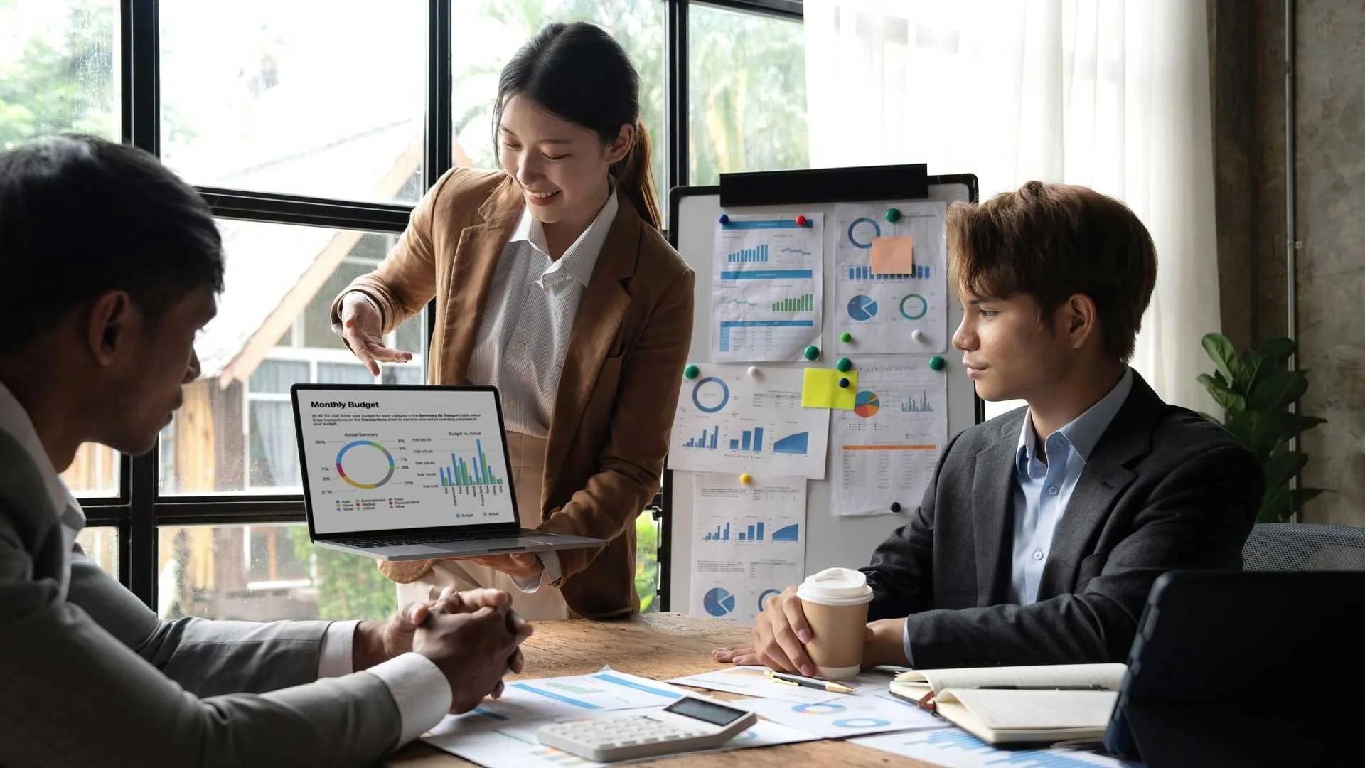 Marketing team reviewing campaign performance charts