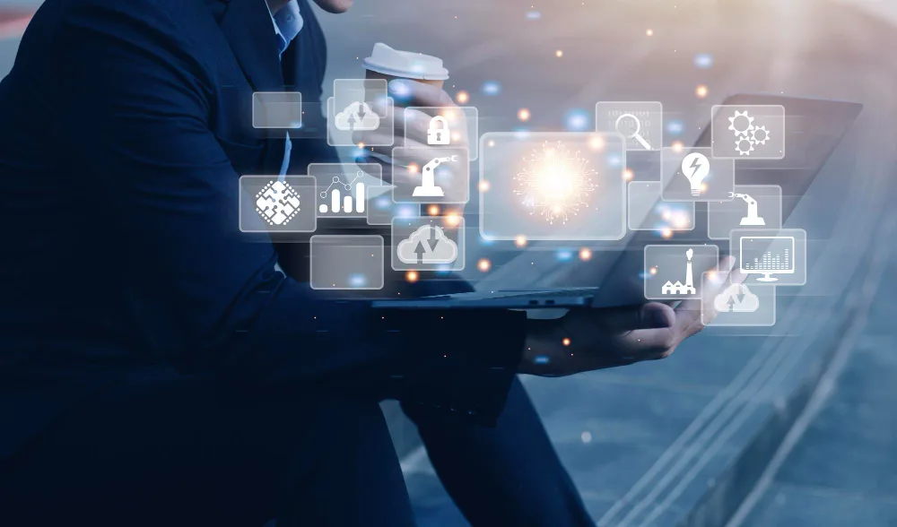 Business user working with connected digital tools on a laptop
